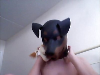 Kinky Girl gets off wearing a rubber dog mask